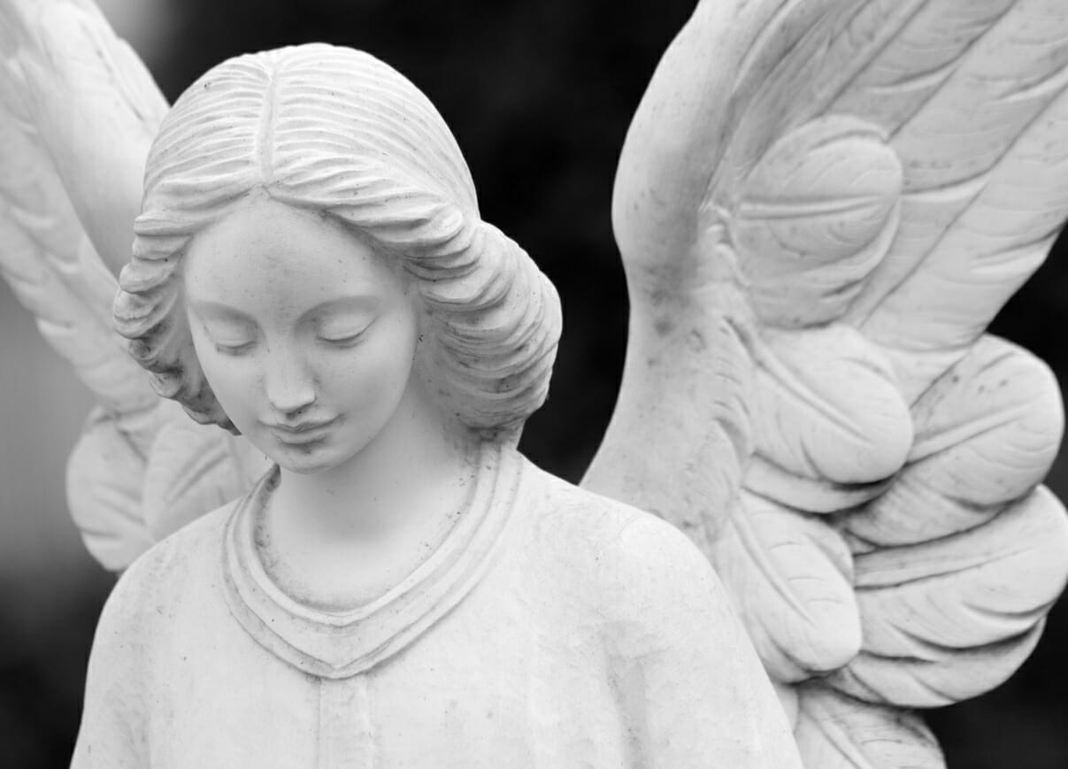 Stone angel statue. A funeral announcement is a way to provide people with information regarding funeral service arrangements.